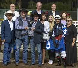The winning connections of Eyesa Wagon My Tale accept the A Ransom Handicap trophy at Los Alamitos on Saturday.