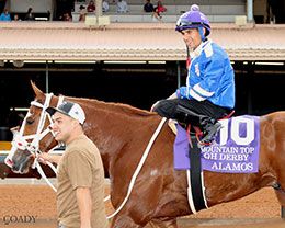 Alamos, under Jockey Mauro Salcedo, returns to the winner's circle after capturing Saturday's Mountain Top New Mexico Bred QH Derby.