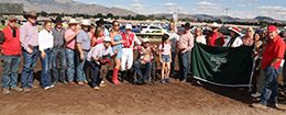The winning connections of Aguila Rapida accept the $200,000 All American Juvenile trophy at the Downs at Albuquerque on Monday.