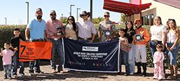 The winning connections of Mysterious Cartel accept the Adequan Derby Challenge Championship-G3 trophy at Albuquerque Downs on Sunday.