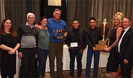 James Bogar (blue shirt) and his team receive Queen Charlotte's award from QROOI directors Chantelle Bourgeois (far left) and Bob Broadstock (far right).