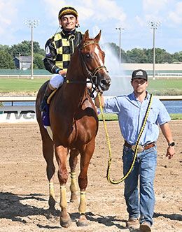 Dassault and jockey Alfredo Triana, Jr. return to thePrairie Meadows Gold Futurity winner's circle on Sunday.