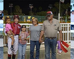 The winning connections of Shaken Goin On accept the $75,000 Abigail Kawananakoa Handicap trophy on Saturday at Los Alamitos.