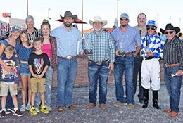 The winning connections of Foxy Cowgirl accept the Future Of Iowa Stakes trophy.