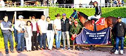 The winning connections of Rg Lethal Knight accept the $17,600 Revelacion Classic trophy at the Hipodromo de las Americas on Sunday.