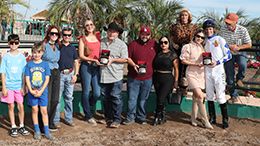 The winning connections of London Bridge accept the Turf Paradise Open Futurity trophy on Monday.
