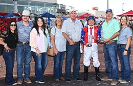 The winning connections of Trapper Gurl accept the Future of Iowa Stakes trophy at Prairie Meadows on Friday.