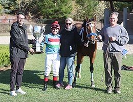 The winning connections of Queen Charlotte accept the $37,361 (US) Alex Picov Memorial Championship trophy at Ajax Downs on Wednesday.