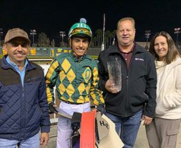 The winning connections of Rockin With Energy, Paul and Marin Jones, Henry Reynoso Lopez, and assistant trainer Roque Gonzalez.