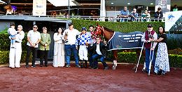 The winning connections of Talk Of The Bar accept the Futurity Las Americas trophy at the Hipodromo de las Americas on Sunday.