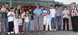The winning connections of Relentless Rocket accept the $25,000 Valley Junction Juvenile Stakes trophy at Prairie Meadows on Friday.