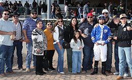 The winning connections of Electrifying Cowboy accept the Grade 2 Southwest Juvenile Championship stakes trophy at Zia Park on Sunday.