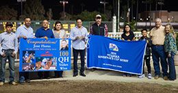 Owner Santos Montemayor and trainer Jose Flores in the winner's circle with Enrique Gonzalez presenting.