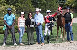 The winning connections of Especially Tempting accept the Ontario Sires Stakes trophy on Wednesday.