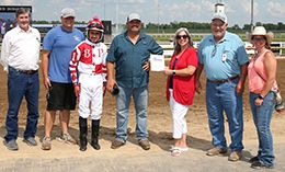 The winning connections of Streakindownthebeach accept the Easys Night Beat Overnight Stakes trophy Horseshoe Indianapolis on Friday.