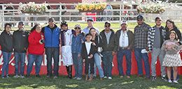 The winning connections of Presido Pete accept the Dolls Prodigy Stakes trophy on Sunday at Arapahoe Park.