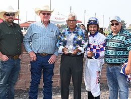 The winning connections of Relentless Purrsuit accept the Prairie Meadows Gold Derby stakes trophy on Sunday.