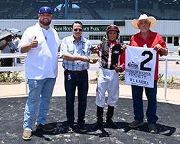 The winning connections of Wl Karma accept the $67,285 Colors Of Houston Futurity [G1] trophy at Sam Houston on Saturday.