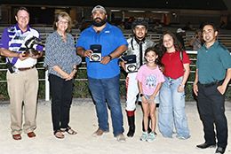 The winning connections of Pops First Lady accept the $60,681 AQHA Texas Challenge Championship Stakes trophy at Retama Park on Friday.