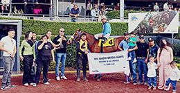 The winning connections of La Feature This Bell accept the trophy after winning $17,600 Chirina Glorys Classic on Sunday at the Hipodromo de las Americas.