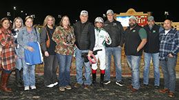 The winning connections of Vesper Martini accept the Texas Hero Juvenile Stakes trophy at Lone Star Park.