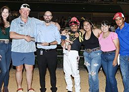 The winning connections of Fabulous Casina accept the La Villita Stakes trophy at Retama Park.