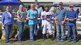 The winning connections of Lynnder 16 accept the $60,962 Cox Ranch Distaff Challenge [G3] trophy at Will Rogers Downs on Sunday.