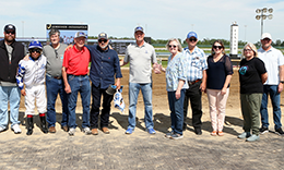 The winning connections of Tachas Secret accept the Born Runner Classic stakes trophy at Horseshoe Indianapolis on Saturday.
