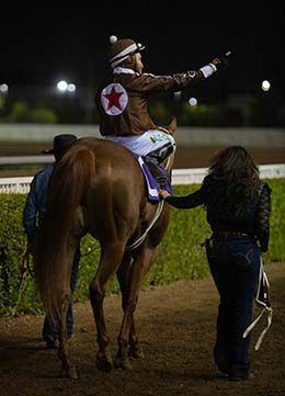 Show N Tell Cartel walks into the Los Alamitos Race Course winner's circle.