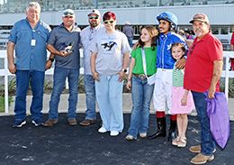 The winning connections of Wl Van Halen accept the $24,500 Colors Of Texas Paint Maturity trophy at Sam Houston on Saturday.