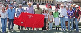 The winning connections of Dance The Dust Off accept the $22,000 Bear River Stakes trophy at Wyoming Downs on Sunday.