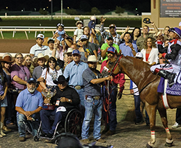The winning connections of Empressum accept the Debbie Schauf Remington Park Invitational Championship stakes trophy on Saturday at Remington Park.
