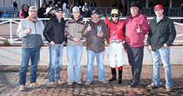 The winning connections of Apollitical Boogie J accept the $100,000 James Isaac Hobbs Stakes-G2 trophy at Zia Park on Sunday.