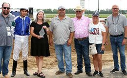 The winning connections of Beach First accept the Blue River Derby stakes trophy at Horseshoe Indianapolis.