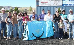 The winning connections of Ajs Favorite Ia accept the Polk County Derby stakes trophy on Saturday.