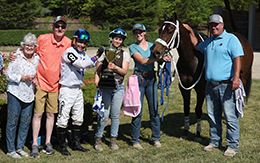 The winning connections of Annies Best Card accept the Unclassied NBT 79 Stakes trophy on Wednesday at Ajax Downs.