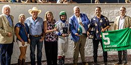 LQHBA Executive Director Bruce Salard presents the winning connections of Rf Fast Dash N Blood the Lee Berwick Futurity stakes trophy and blanket at Delta Downs Saturday.
