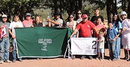 The winning connections of Bout Ta Learn Yall accept the John Andrini Memorial Stakes stakes trophy on Monday at Ruidoso Downs.
