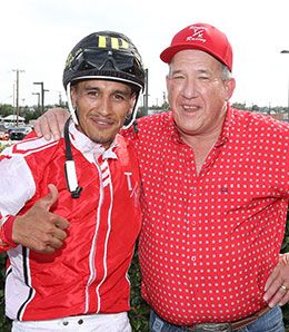 Jockey Juan Pulido and trainer Toby Keeton celebrate their second stakes win on Saturday's card.
