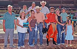 The winning connections of Flying Wrangler accept the $17,425 Cherokee Nation Stakes trophy at Fair Meadows on Saturday.