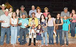 The winning connections of Blowin In The Wind accept the Speedhorse Quarter Horse Futurity stakes trophy at Fair Meadows Saturday.