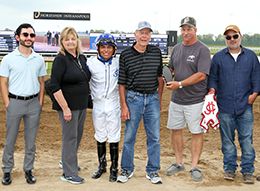 The winning connections of Tachas Secret accept the $85,800 Bob Woodard Memorial Stakes trophy at Horseshoe Indianapolis on Saturday.
