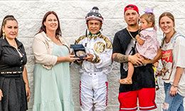 Yolanda Fierros, Kori Hebert, jockey Ricardo Hernandez, Jr, Trainer Jose Carrizales with daughter Camila, and Alyse Hudson, accept the Louisiana Starter Stakes trophy at Delta Downs on July 12.