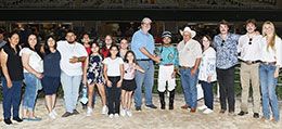 The winning connections of Hes A Jet One accept the TQHA Classic Stakes trophy.