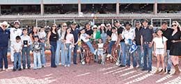 The winning connections of Harken accept the West Texas Derby stakes trophy at Sunland Park on Saturday.
