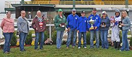 The winning connections of Relentless American accept the $199,872 Mystery Futurity trophy at Will Rogers Downs on Monday.