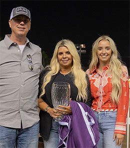Dunn Ranch's Matt, Bendi, and Madison Dunn accept the Mildred Vessels Memorial Handicap stakes trophy at Los Alamitos Race Course.