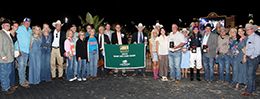 The connections of Just Dulce accept the trophy after winning the Dash For Cash Derby-G2 on Saturday at Lone Star Park.