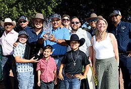 The winning connections of Fdd Dreams accept the Ruidoso QH Derby stakes trophy Saturday at Ruidoso Downs Racetrack & Casino.