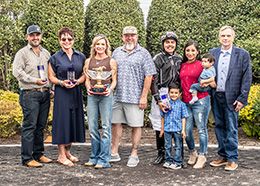 The winning connections of Mamma Im Leaving You accept the $100,000 Mardi Gras Oaks trophy at Louisiana Downs on Friday.